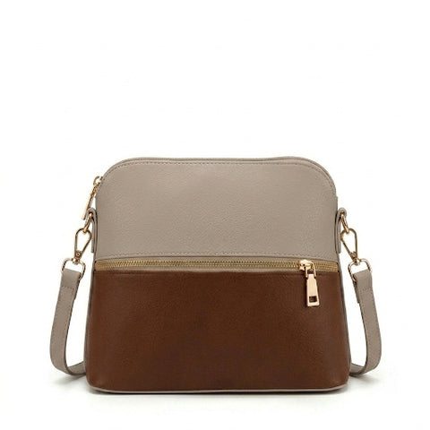 Two toned beige and brown crossbody bag with gold zipper on a white background